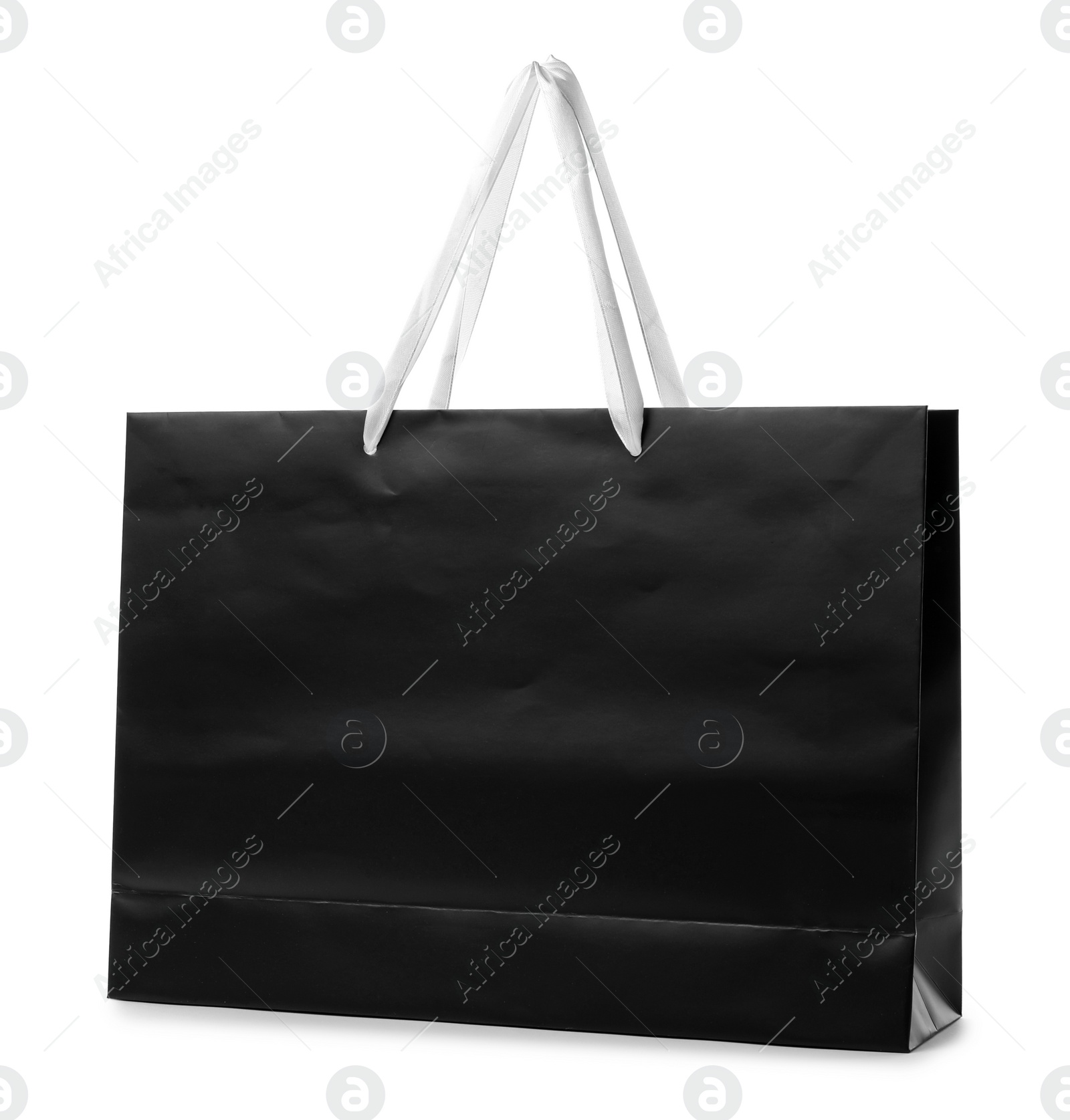 Photo of Paper shopping bag with handles on white background. Mockup for design