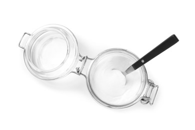 Photo of Baking soda and spoon in glass jar isolated on white, top view