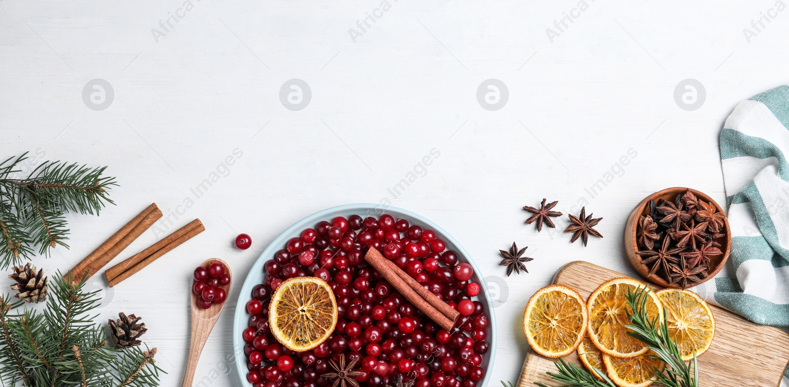 Image of Flat lay composition with fresh ripe cranberries on white wooden table, space for text. Banner design