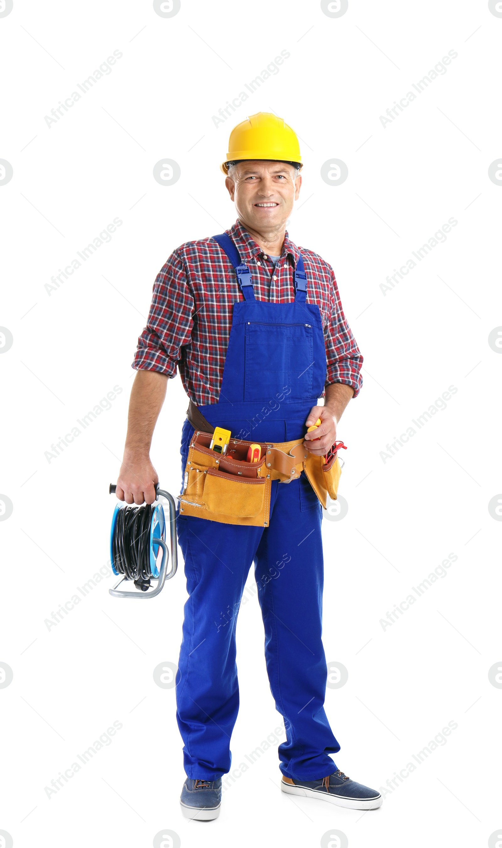 Photo of Electrician with extension cord reel and tools  wearing uniform on white background