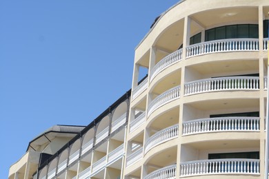 Photo of Exteriorbeautiful residential building with balconies against blue sky