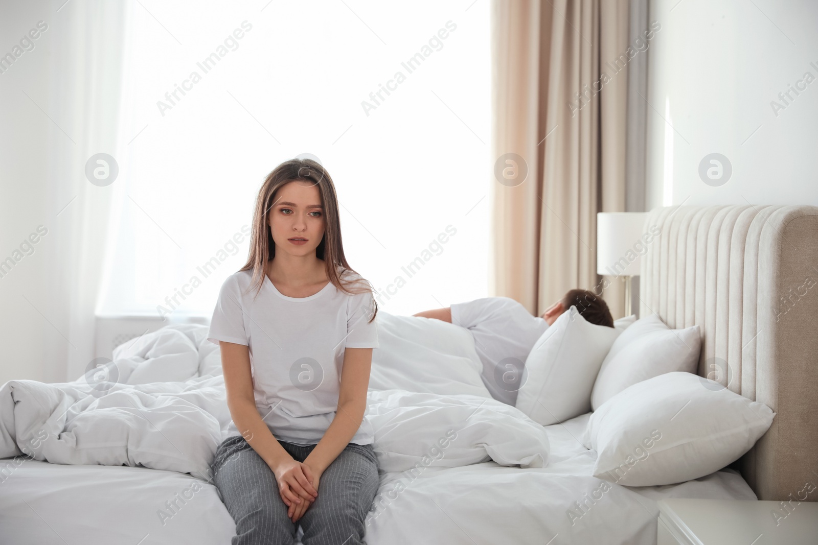 Photo of Unhappy couple with problems in relationship at home