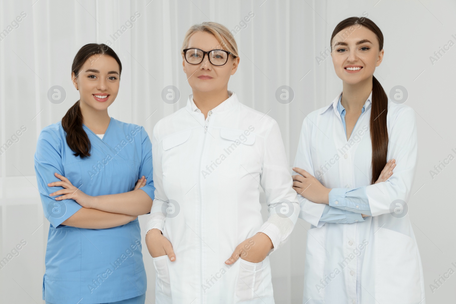 Photo of Portrait of medical doctors wearing uniforms indoors