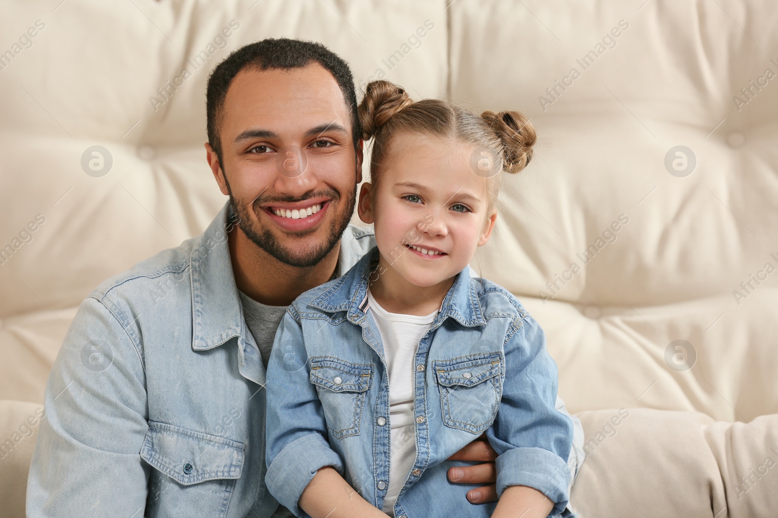 Photo of Little girl with her father spending time together. International family