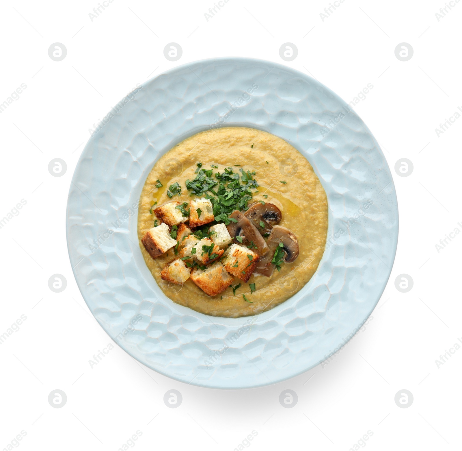 Photo of Delicious cream soup with mushrooms and croutons on white background, top view