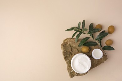 Flat lay composition with different natural cosmetic products on beige background. Space for text