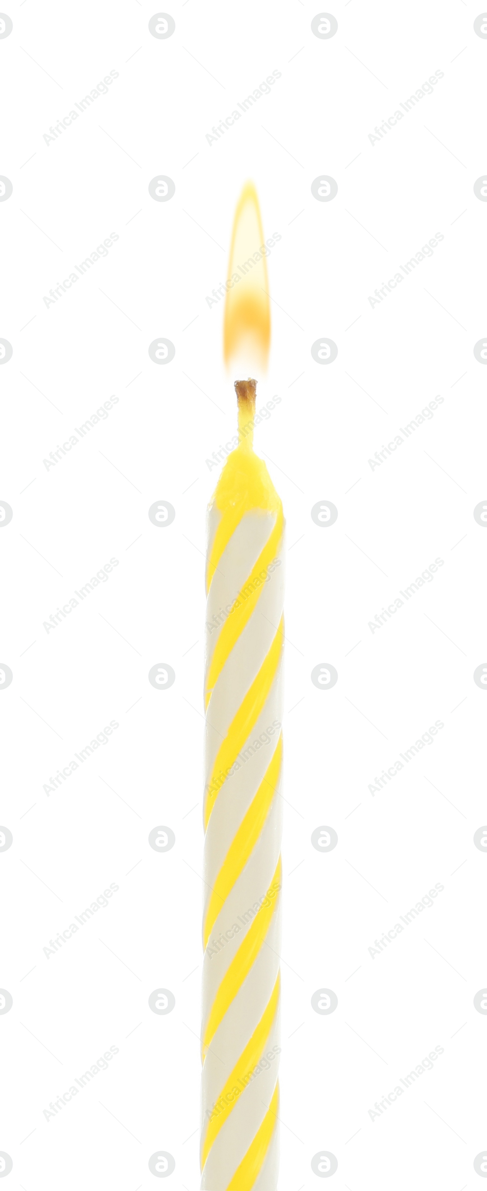 Photo of Yellow birthday cake candle isolated on white