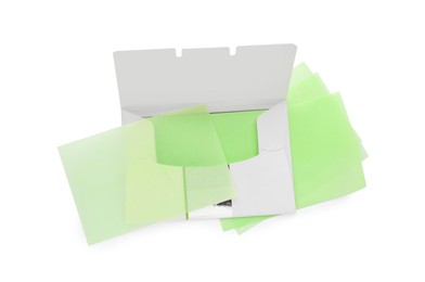 Package of facial oil blotting tissues on white background, top view. Mattifying wipes