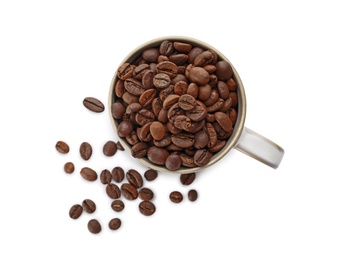 Photo of Cup and coffee beans on white background, top view