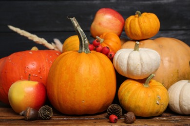 Photo of Happy Thanksgiving day. Beautiful composition with pumpkins on wooden table