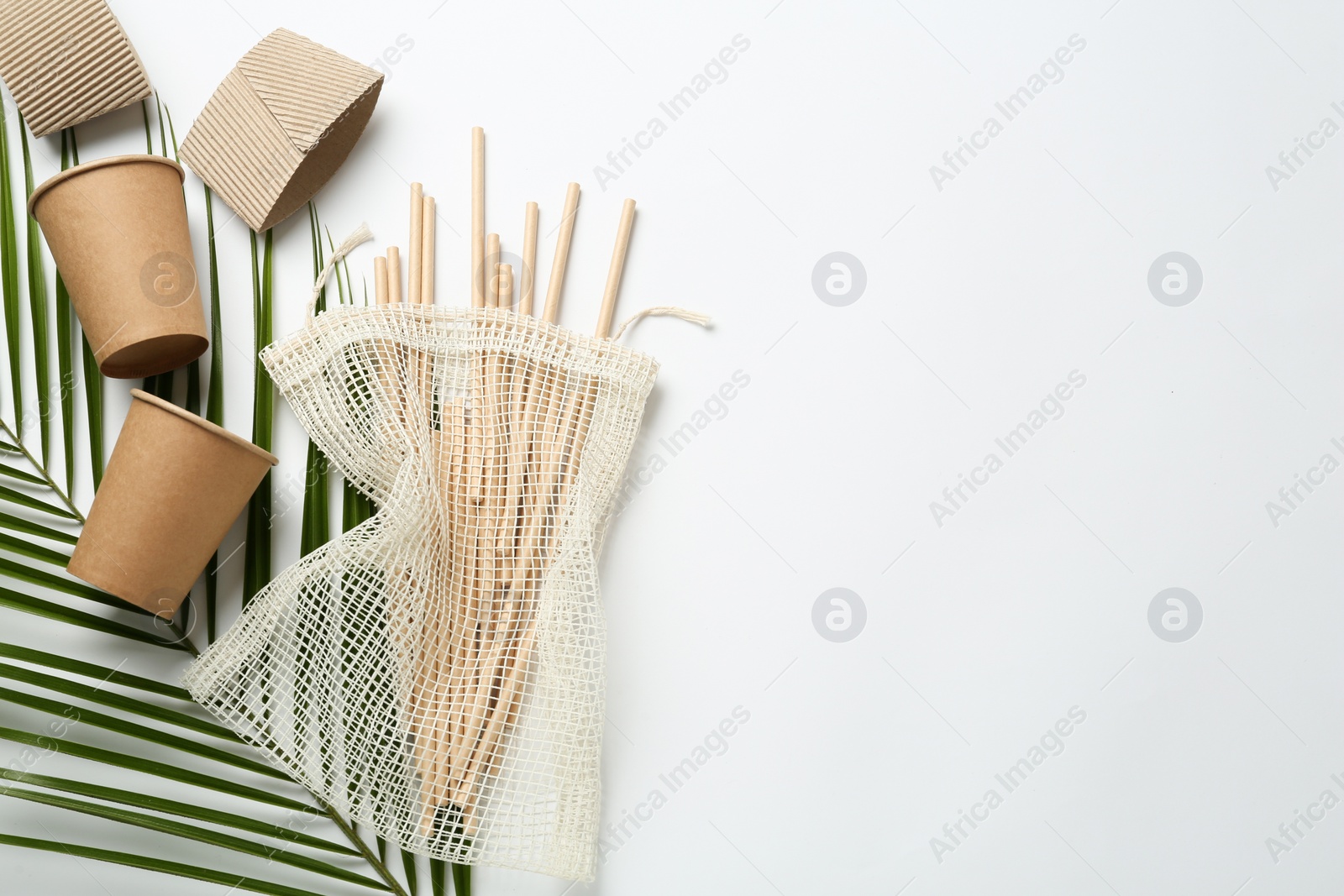 Photo of Eco friendly products on white background, flat lay. Space for text