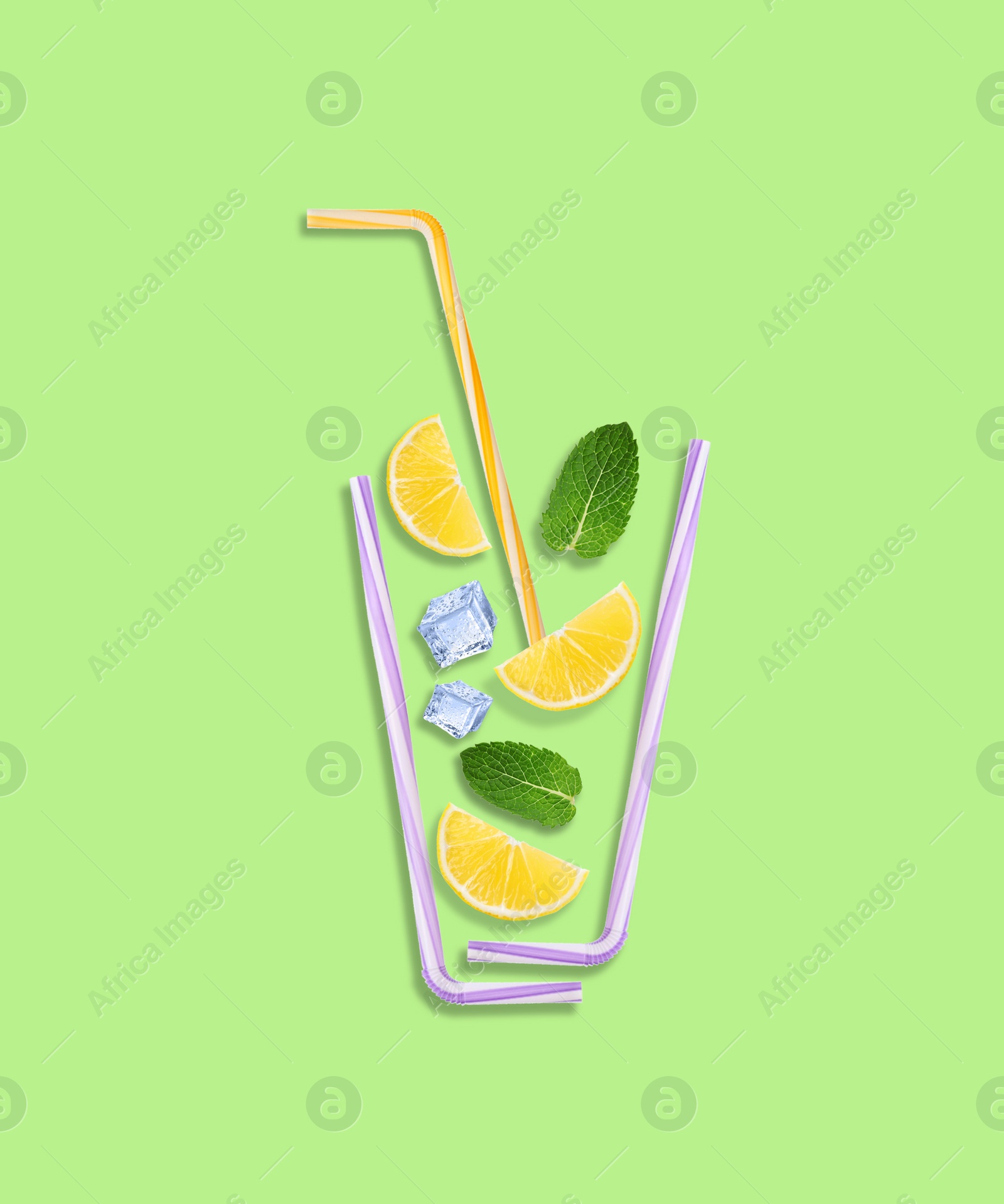 Image of Creative lemonade layout with lemon slices, mint, ice cubes and straws on light green background, top view
