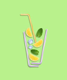 Creative lemonade layout with lemon slices, mint, ice cubes and straws on light green background, top view