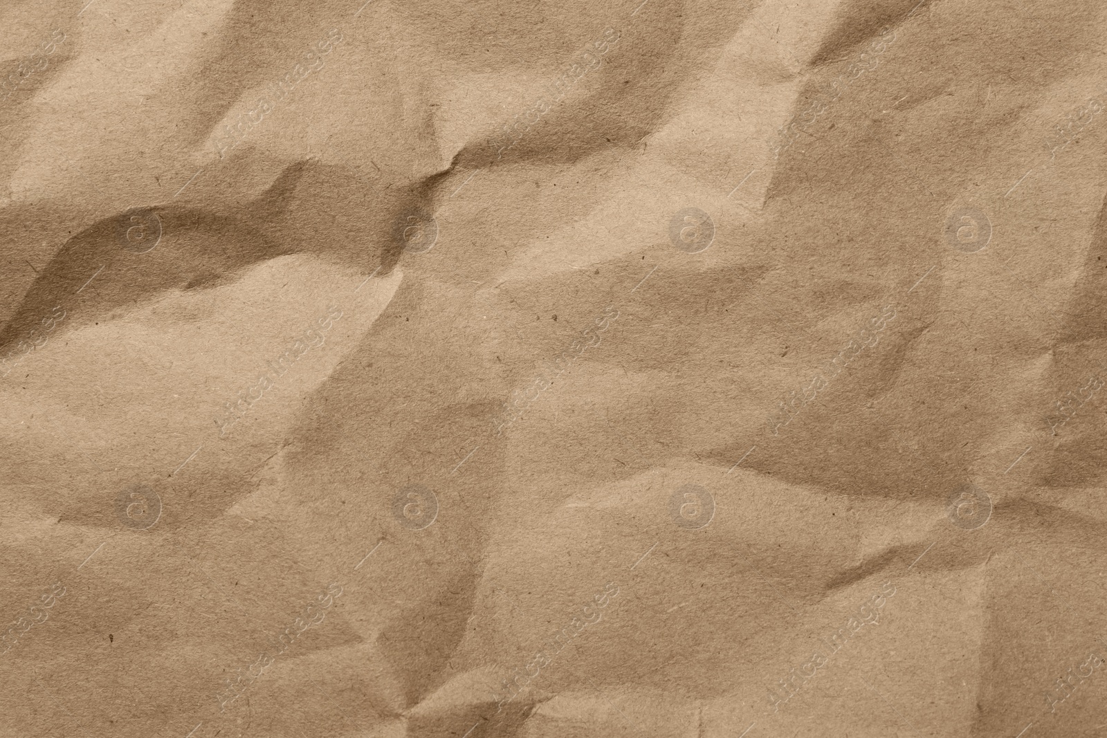 Photo of Brown crumpled paper texture as background, top view