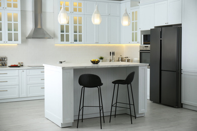 Photo of Beautiful kitchen interior with new stylish furniture