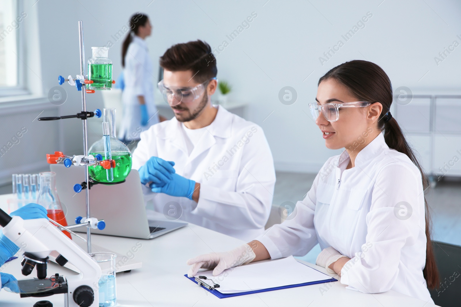 Photo of Medical students working in modern scientific laboratory