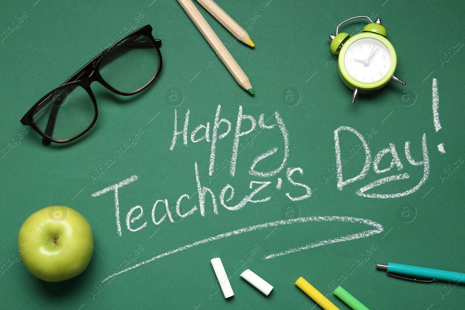 Photo of Flat lay composition with words HAPPY TEACHER'S DAY on chalkboard