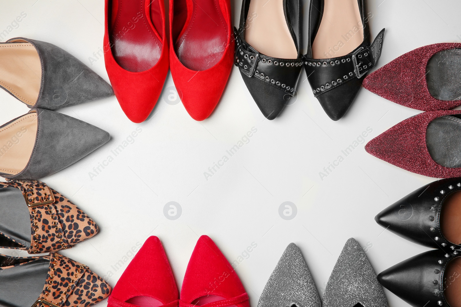 Photo of Different female shoes on white background