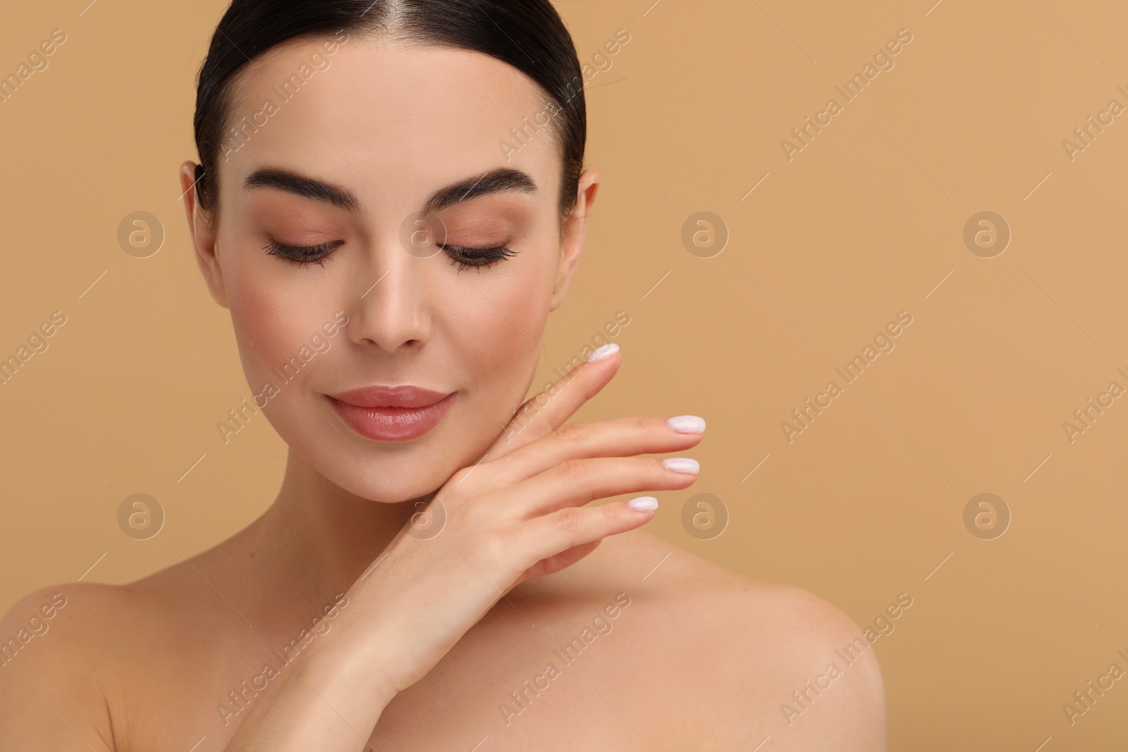 Photo of Beautiful woman with healthy skin on beige background, space for text