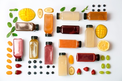 Flat lay composition with healthy detox smoothies and ingredients on light background