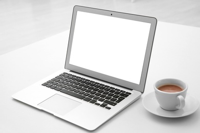 Comfortable workplace with modern laptop on table. Mockup for design