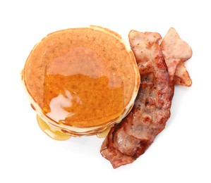 Photo of Delicious pancakes with maple syrup and fried bacon on white background, top view