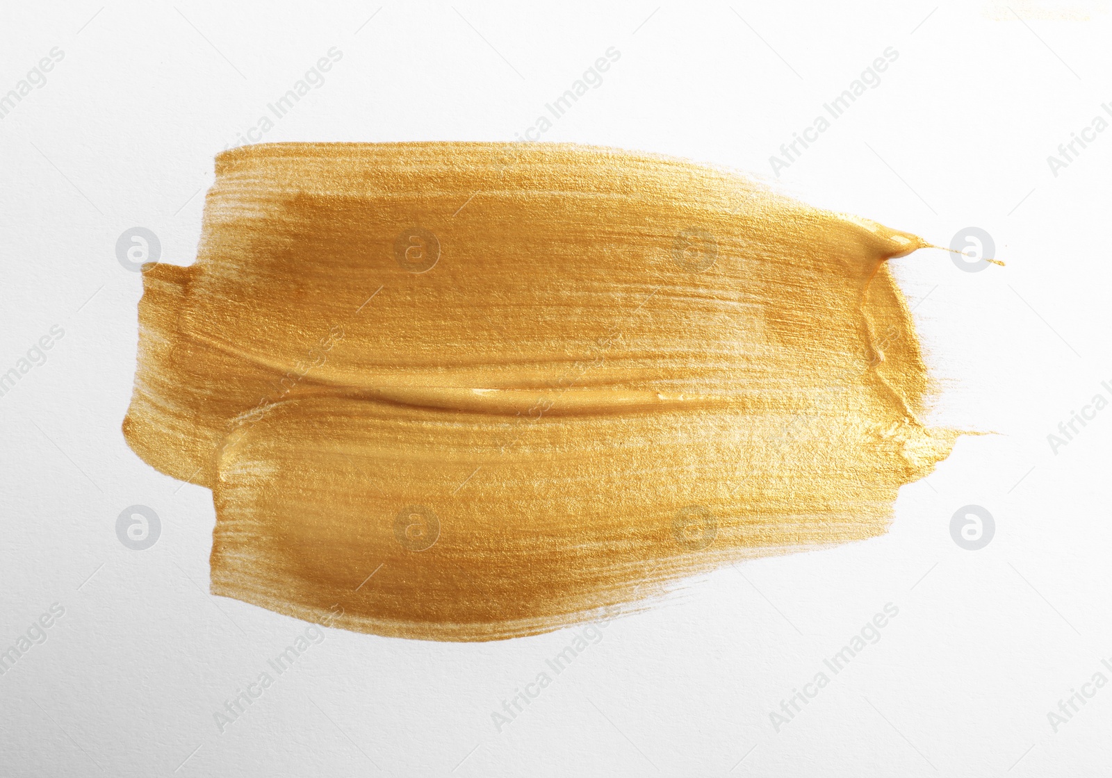 Photo of Strokes of gold paint isolated on white, top view