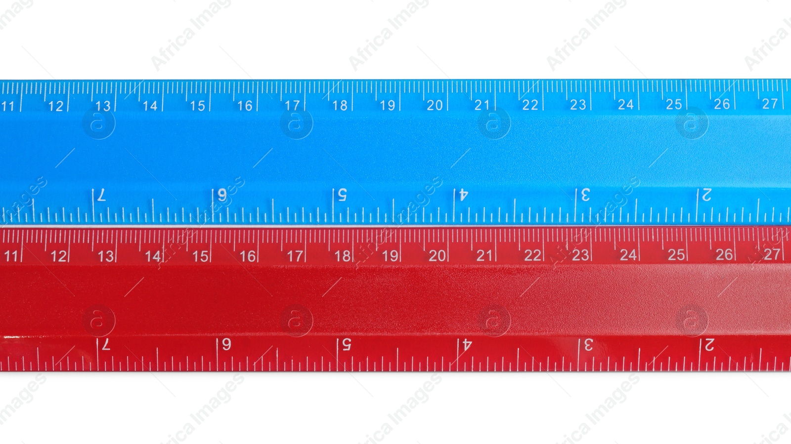 Photo of Rulers with measuring length markings in centimeters isolated on white, top view