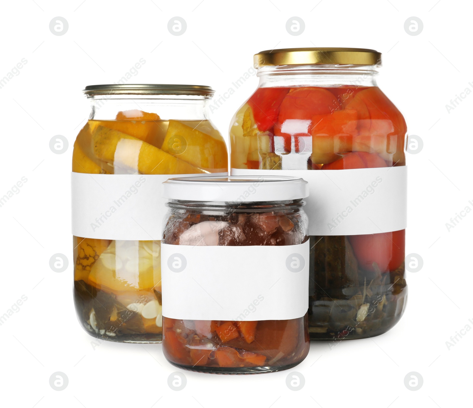 Photo of Jars of pickled vegetables with blank labels on white background