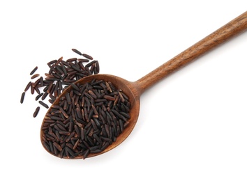 Photo of Spoon with uncooked black rice on white background, top view