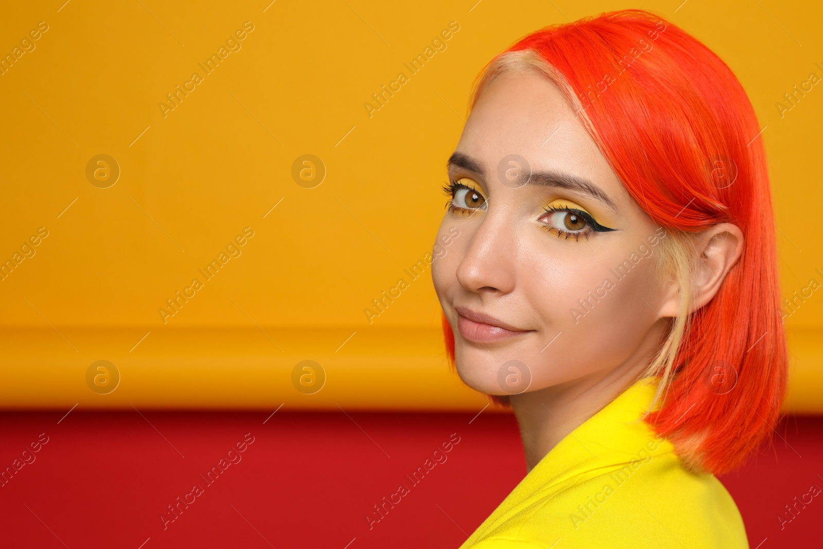 Photo of Beautiful young woman with bright dyed hair on color background, space for text