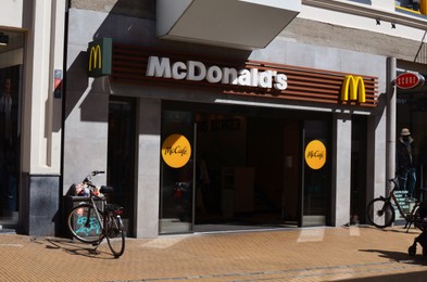 GRONINGEN, NETHERLANDS - APRIL 20, 2022: Entrance of restaurant MacDonalds on city street