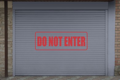 Image of Text Do Not Enter on roller shutter garage door outdoors