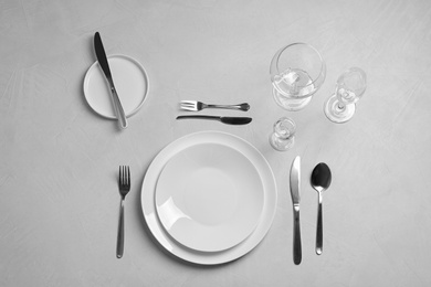 Photo of Stylish elegant table setting on light background, top view