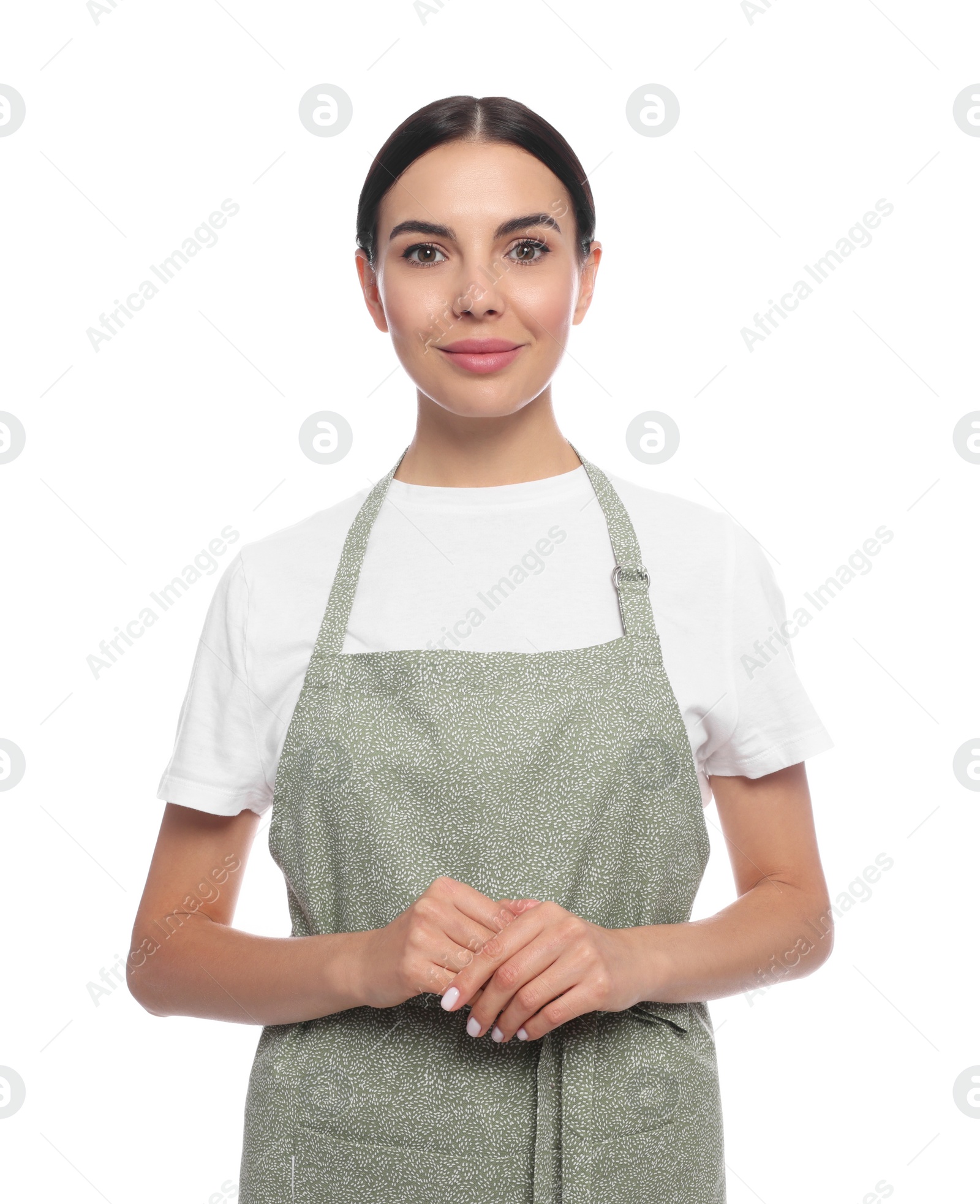 Photo of Young woman in light green apron on white background