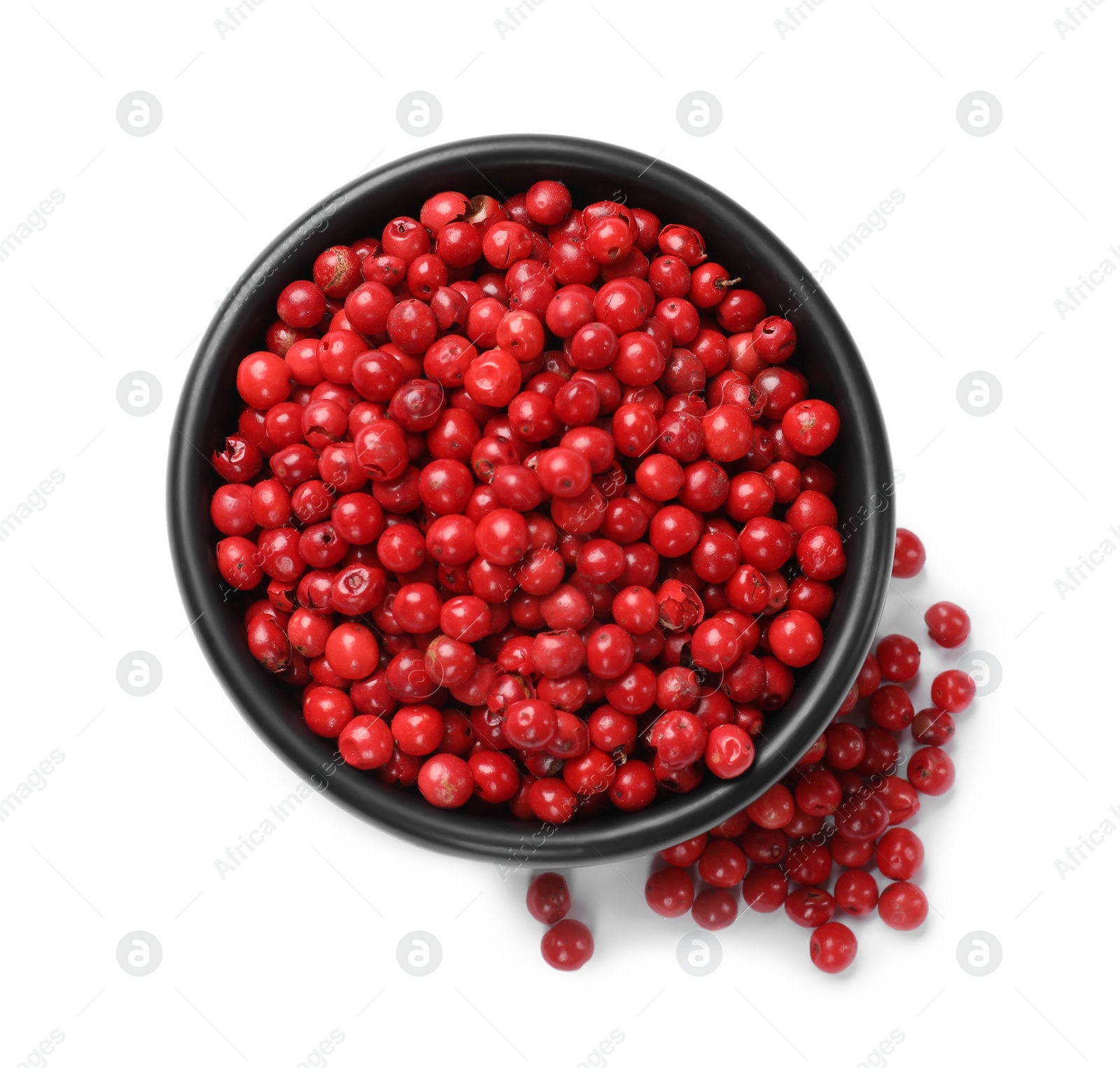 Photo of Aromatic spice. Red pepper in bowl isolated on white, top view