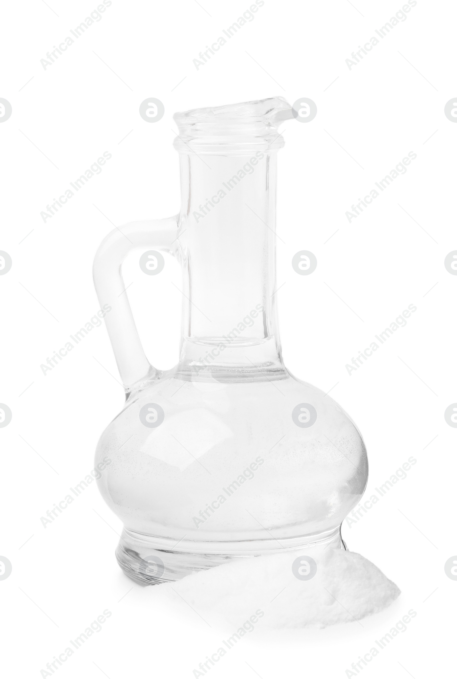 Photo of Vinegar in glass jug and baking soda isolated on white