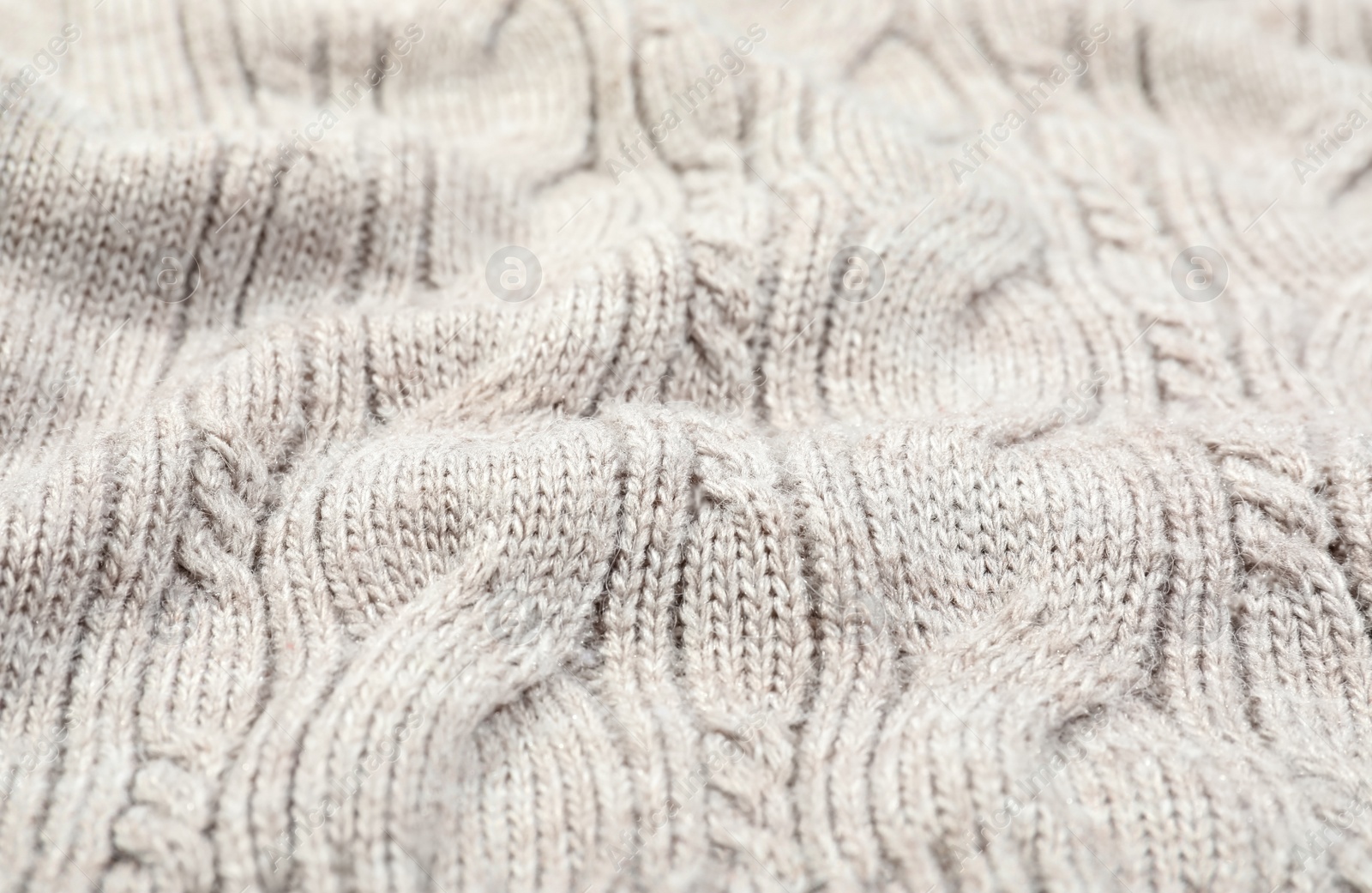 Photo of Texture of cozy warm sweater as background, closeup