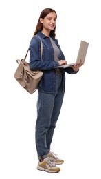 Teenage student with laptop and backpack on white background