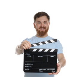 Making movie. Smiling man with clapperboard on white background