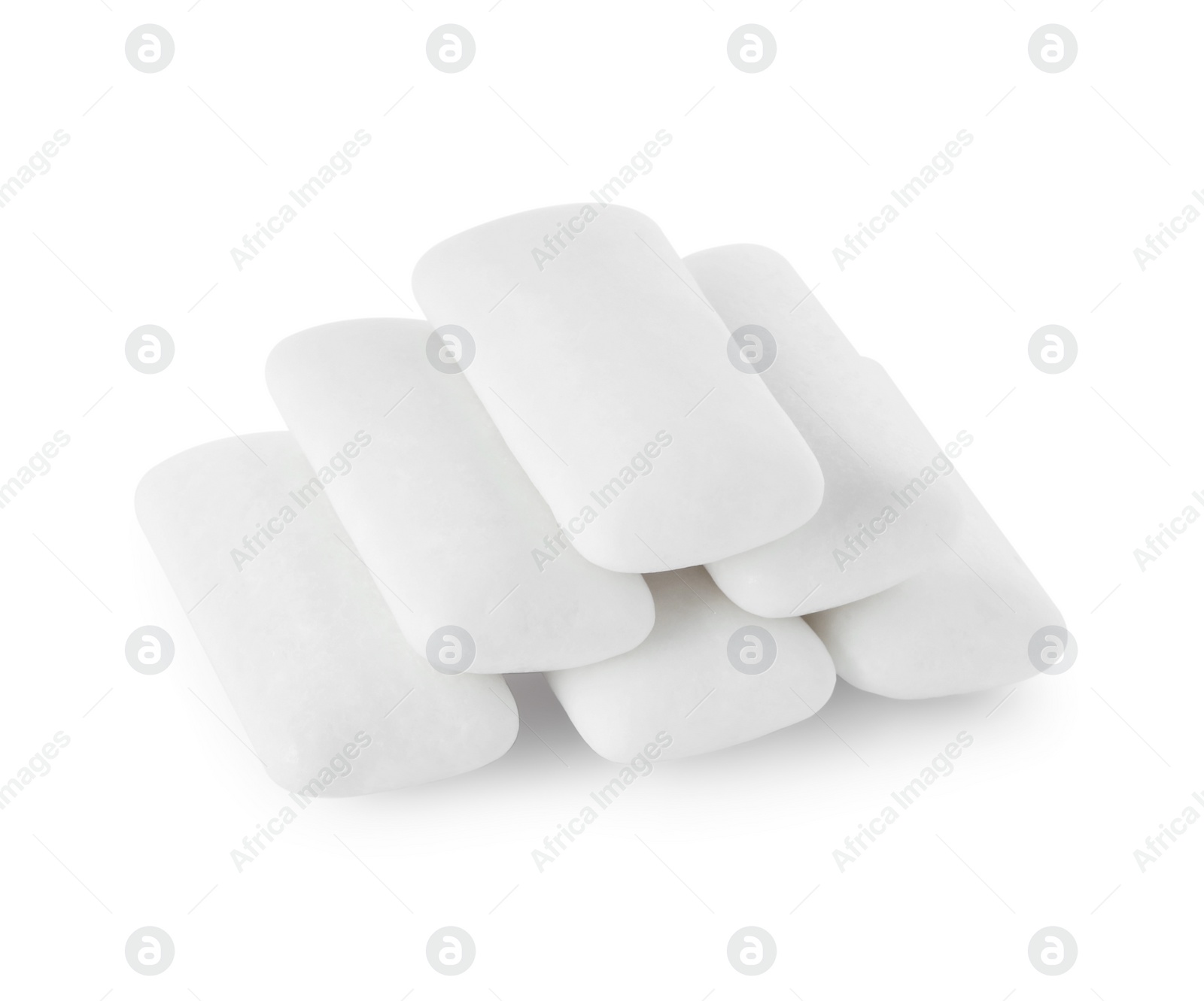 Photo of Pile of tasty chewing gums on white background