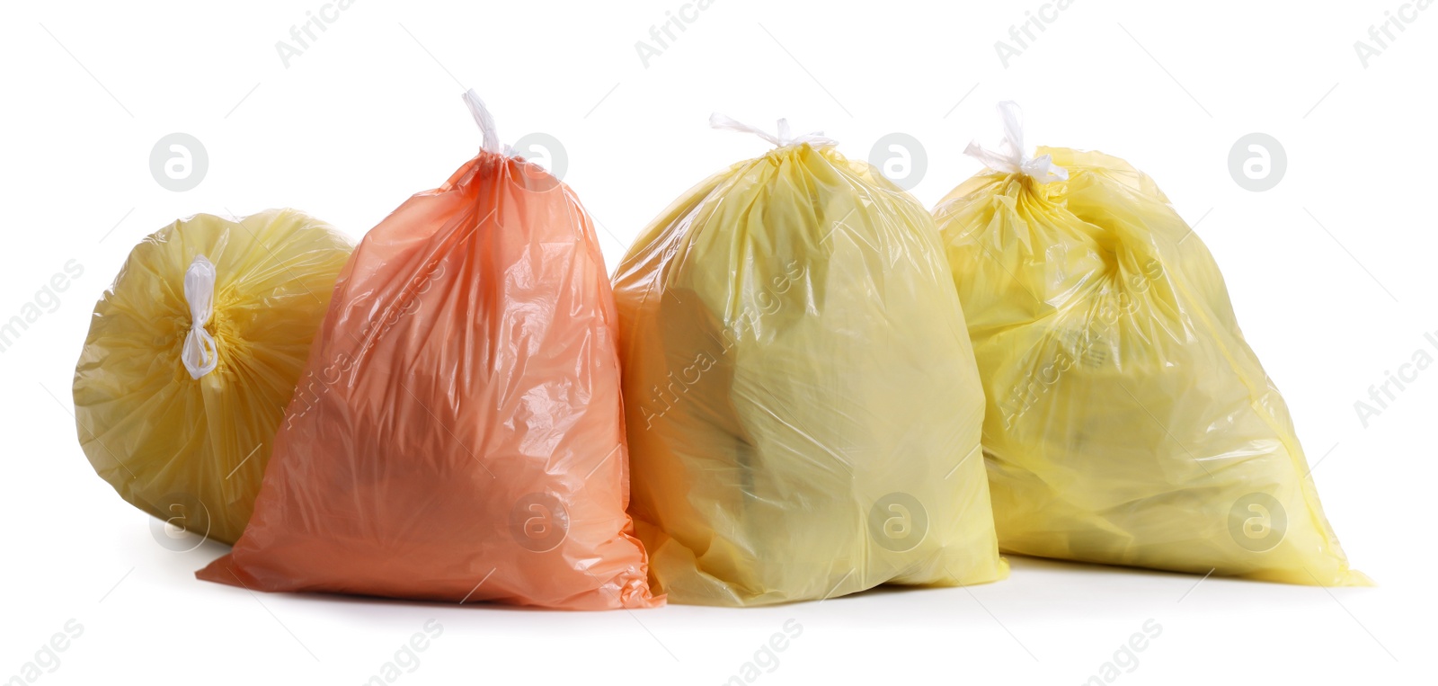 Photo of Trash bags full of garbage on white background