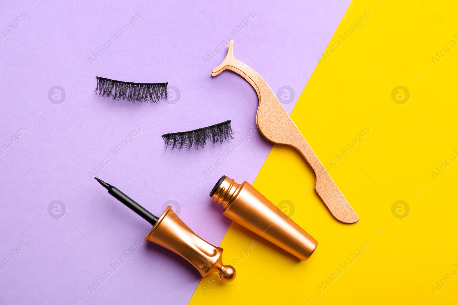 Photo of Flat lay composition with magnetic eyelashes and accessories on color background