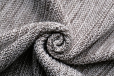 Beautiful grey knitted fabric as background, top view