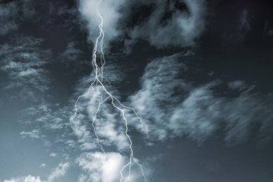 Image of Lightning in sky covered with rainy clouds. Stormy weather