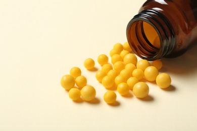 Photo of Bottle with vitamin pills on color background, closeup. Space for text