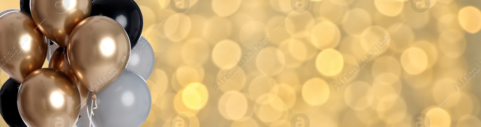 Image of Bright balloons on color background with bokeh effect, space for text. Banner design