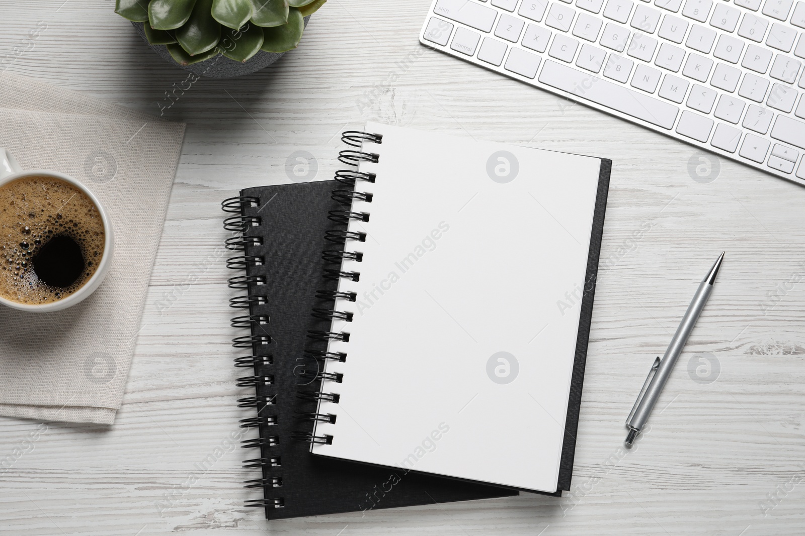 Photo of Flat lay composition with stylish notebooks on white wooden table