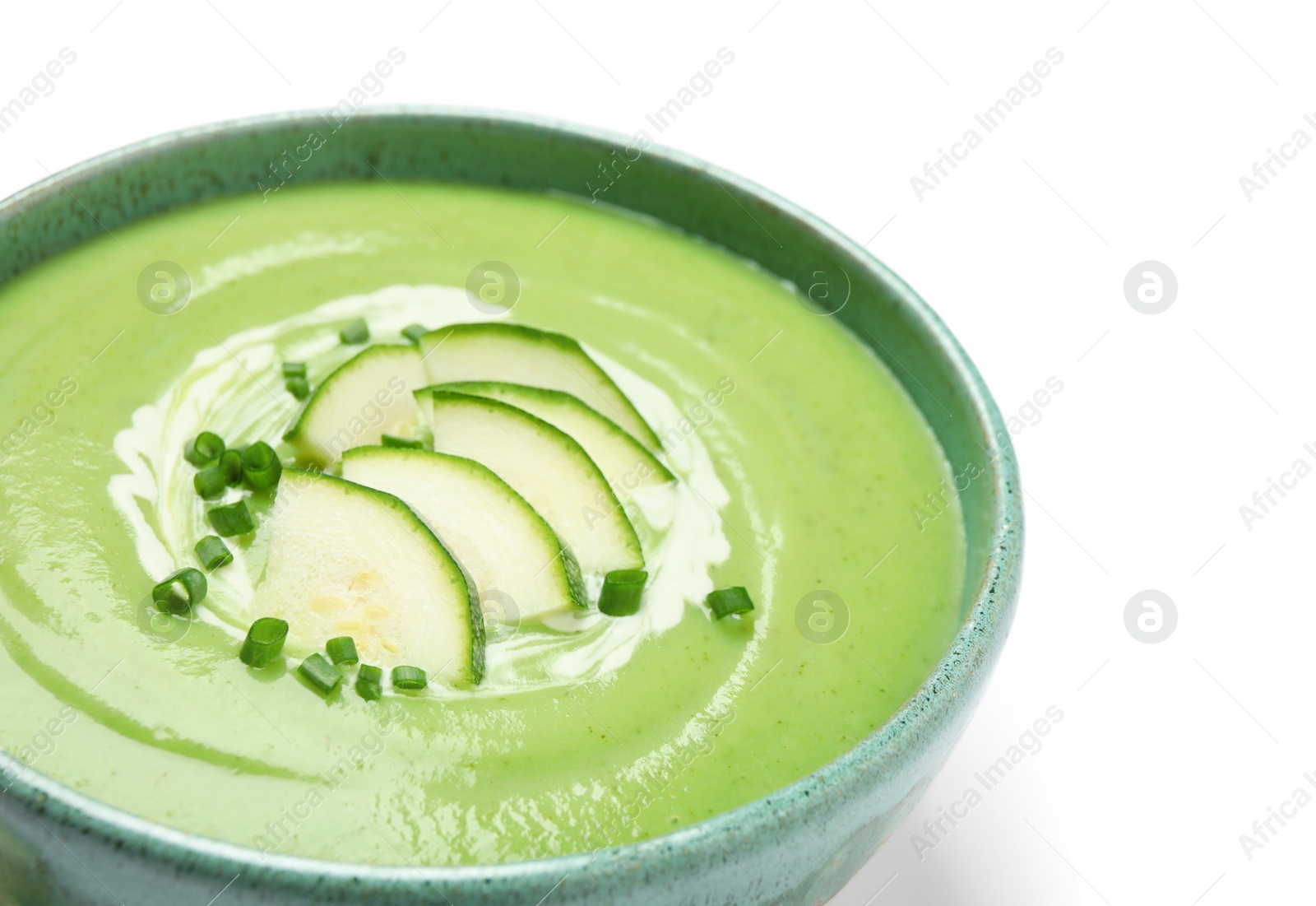 Photo of Tasty homemade zucchini cream soup isolated on white, closeup