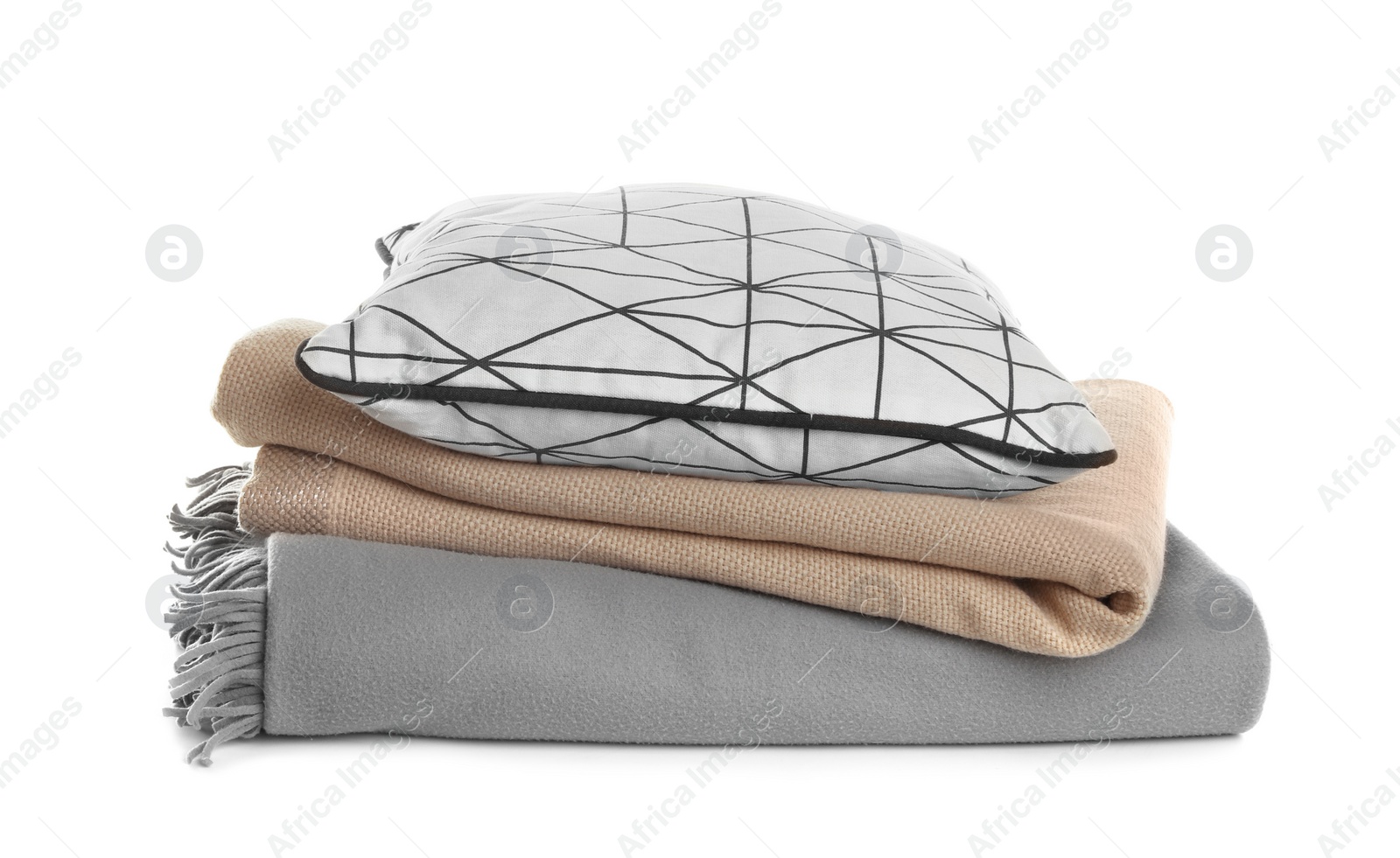 Photo of Stylish soft pillow and folded plaids on white background